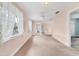 Spacious bonus room with large windows for natural light, offering versatile space for various activities at 2002 8Th W St, Palmetto, FL 34221