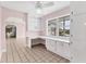 Bright bonus room with built-in desk, cabinets, and a view of the lake at 2002 8Th W St, Palmetto, FL 34221