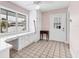 Bright bonus room with lots of natural light, built-in storage, and tiled flooring at 2002 8Th W St, Palmetto, FL 34221