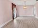 A bright and airy dining room with lots of natural light, plenty of open space, and wood laminate floors at 2002 8Th W St, Palmetto, FL 34221
