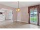 A bright and airy dining room with lots of natural light, plenty of open space, and wood laminate floors at 2002 8Th W St, Palmetto, FL 34221