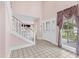 A grand foyer with high ceilings, tile flooring, and a beautiful front door, creating a welcoming entrance at 2002 8Th W St, Palmetto, FL 34221