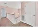 Upstairs hallway featuring a staircase and neutral walls at 2002 8Th W St, Palmetto, FL 34221