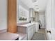 Functional laundry room with washer, dryer, sink, and storage cabinets for convenience at 2002 8Th W St, Palmetto, FL 34221