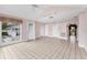 Bright living room with tiled floors and views of a pool and other rooms in the home at 2002 8Th W St, Palmetto, FL 34221