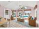 Bright waterfront living room featuring rattan furniture, high ceilings, and beautiful water views at 2002 8Th W St, Palmetto, FL 34221