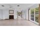 Bright living room featuring a fireplace, neutral paint, hardwood floors and large windows at 2002 8Th W St, Palmetto, FL 34221