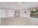 Bright living room with tiled floors and views of a patio and other rooms in the home at 2002 8Th W St, Palmetto, FL 34221