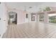 Bright living room with views of the waterway, tiled floors, and a view to the kitchen at 2002 8Th W St, Palmetto, FL 34221