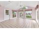 Bright living room with views of the waterway, tiled flooring, and a nearby door at 2002 8Th W St, Palmetto, FL 34221