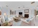 Cozy living room with a fireplace, comfortable seating, and a bright and open design at 2002 8Th W St, Palmetto, FL 34221