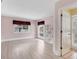 A bright and airy living room with lots of natural light, plenty of open space, and wood laminate floors at 2002 8Th W St, Palmetto, FL 34221