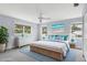 Bright main bedroom with coastal decor, ample natural light, and a serene ambiance for relaxation at 2002 8Th W St, Palmetto, FL 34221