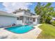 A beautiful backyard featuring a refreshing pool, patio, and lawn, perfect for relaxation and outdoor fun at 2002 8Th W St, Palmetto, FL 34221