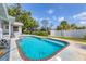 Beautiful backyard with a pool, lounge chairs, and a view of the boat lift on the canal at 2002 8Th W St, Palmetto, FL 34221