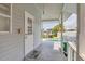 Covered porch overlooking a pool, canal and dock, perfect for relaxing and entertaining at 2002 8Th W St, Palmetto, FL 34221