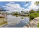 Scenic waterfront view showcases a tranquil canal and lush greenery, perfect for boating at 2002 8Th W St, Palmetto, FL 34221
