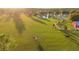 Expansive property with lush pasture, pond, and equestrian fencing, offering a serene countryside retreat at 20504 65Th E Ave, Bradenton, FL 34211