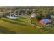 Serene property with horse fencing, lush green pastures, a tranquil pond, and charming barn, all set in a picturesque landscape at 20504 65Th E Ave, Bradenton, FL 34211