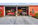 Interior view of barn featuring equipment, storage, and an American flag at 20504 65Th E Ave, Bradenton, FL 34211