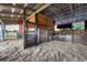 Open-air barn stall with sand flooring and wood construction at 20504 65Th E Ave, Bradenton, FL 34211