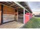Interior barn shot of the stalls showing the beam construction at 20504 65Th E Ave, Bradenton, FL 34211