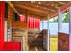 Interior view of open-air barn highlighting wood beam construction and functional space at 20504 65Th E Ave, Bradenton, FL 34211