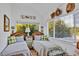 Bright bedroom with two twin beds, cheerful decor, and natural light from the large window at 20504 65Th E Ave, Bradenton, FL 34211