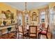 Formal dining room featuring hardwood floors, a chandelier, and ample natural light at 20504 65Th E Ave, Bradenton, FL 34211