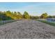 Large equestrian arena with white fencing, perfect for riding and training at 20504 65Th E Ave, Bradenton, FL 34211