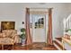 Stylish foyer with hardwood floors, checkered curtains, and a staircase, creating a welcoming atmosphere at 20504 65Th E Ave, Bradenton, FL 34211