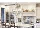 A kitchen features an island with stool seating, marble countertops, and stainless appliances at 20504 65Th E Ave, Bradenton, FL 34211