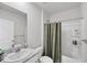Clean bathroom with a shower/tub combo, single sink, and marble countertops at 2105 Grand Flora Trl, Bradenton, FL 34208