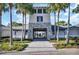 Inviting community entrance featuring stone accents, lush landscaping and paved walkway at 2105 Grand Flora Trl, Bradenton, FL 34208