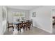 A bright dining room with traditional furnishings and natural light at 2105 Grand Flora Trl, Bradenton, FL 34208