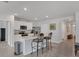 Spacious kitchen with marble island featuring barstool seating, and stainless steel appliances at 2105 Grand Flora Trl, Bradenton, FL 34208