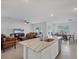 Open-concept kitchen with island that seamlessly connects to the living and dining areas at 2105 Grand Flora Trl, Bradenton, FL 34208