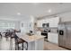 Modern kitchen with stainless steel appliances, white cabinets, and marble countertops at 2105 Grand Flora Trl, Bradenton, FL 34208