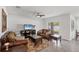 Bright living room with traditional furnishings, tile floors, and backyard views at 2105 Grand Flora Trl, Bradenton, FL 34208