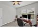 Functional home office space with carpet flooring, a ceiling fan and great lighting at 2105 Grand Flora Trl, Bradenton, FL 34208