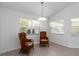 Bright breakfast nook with vaulted ceilings, neutral tile flooring, and lots of natural light at 2199 Palm Ct, North Port, FL 34287