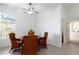 A formal dining area with a round table and seating is located adjacent to the kitchen at 2199 Palm Ct, North Port, FL 34287