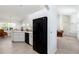 A bright kitchen features white cabinets, a black refrigerator, and an eat-in area at 2199 Palm Ct, North Port, FL 34287