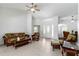 A well-lit living room boasts tile flooring and an open layout leading to the home's entrance at 2199 Palm Ct, North Port, FL 34287