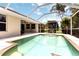 Screened-in pool with a well-maintained deck, perfect for outdoor relaxation and enjoyment at 2199 Palm Ct, North Port, FL 34287