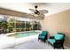 Enclosed pool area with comfortable seating and scenic views, creating a tranquil oasis at 2199 Palm Ct, North Port, FL 34287