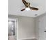 Bedroom featuring a ceiling fan, neutral walls and access to the bathroom at 23367 Mayville Ave, Punta Gorda, FL 33980