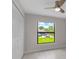 Bright bedroom with a ceiling fan, closet and a view of the outdoors from the window at 23367 Mayville Ave, Punta Gorda, FL 33980