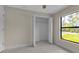 Bedroom with white closet and natural light from window at 23367 Mayville Ave, Punta Gorda, FL 33980