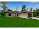 Well-maintained one story home offers a serene setting and a meticulously kept lawn at 23367 Mayville Ave, Punta Gorda, FL 33980